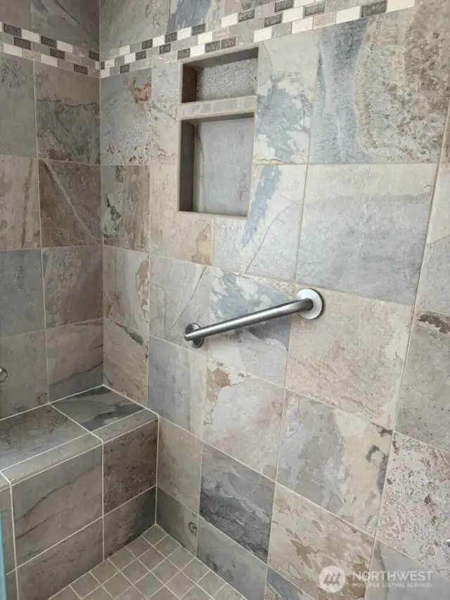 Walk in shower, beautiful tile. ADA compliant