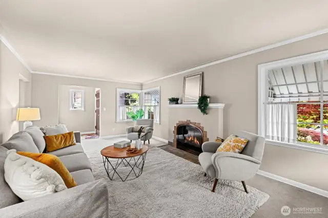 A wonderfully spacious living room with GAS fireplace and corner windows