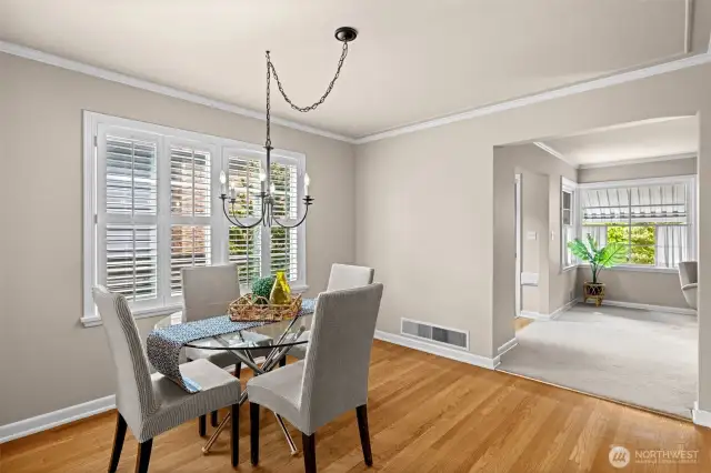 Very spacious dining room with wood shutters