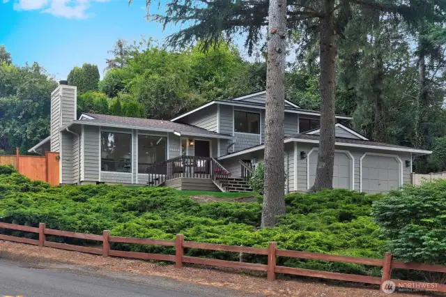 Welcome home to this NW traditional perched up on the hill in the heart Juanita Point in desirable Kirkland. Enjoy Lake WA views from your charming front deck