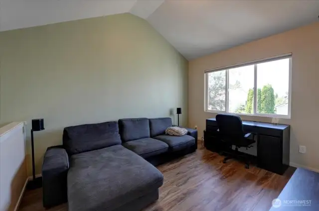 Upstairs bonus room with vaulted ceilings.