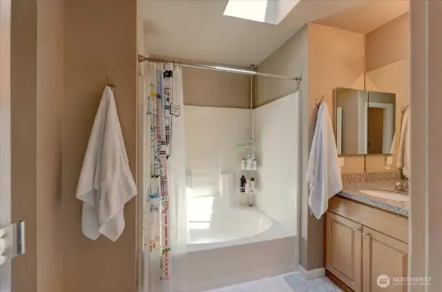 Primary bath with soaking tub/shower combination.
