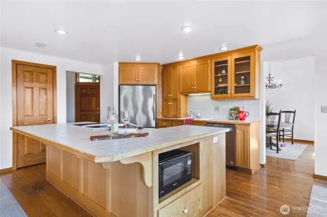 Kitchen has a walk in pantry and plenty of cabinets, large island, with counter height seating.
