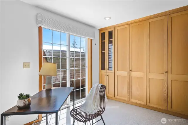 Murphy bed with adjoining full bathroom, flexible space could be an office or guest room. Sauna just outside slider doors.