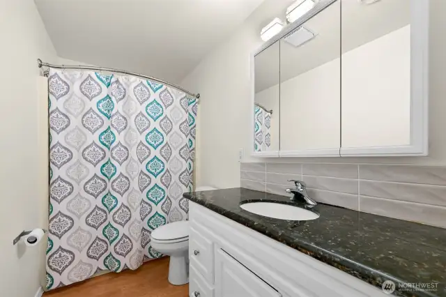 Full bathroom with granite countertop
