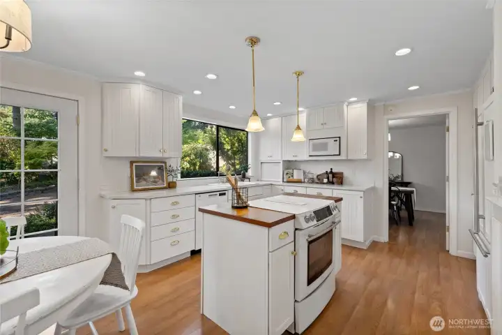 Spacious kitchen looks out on back yard.