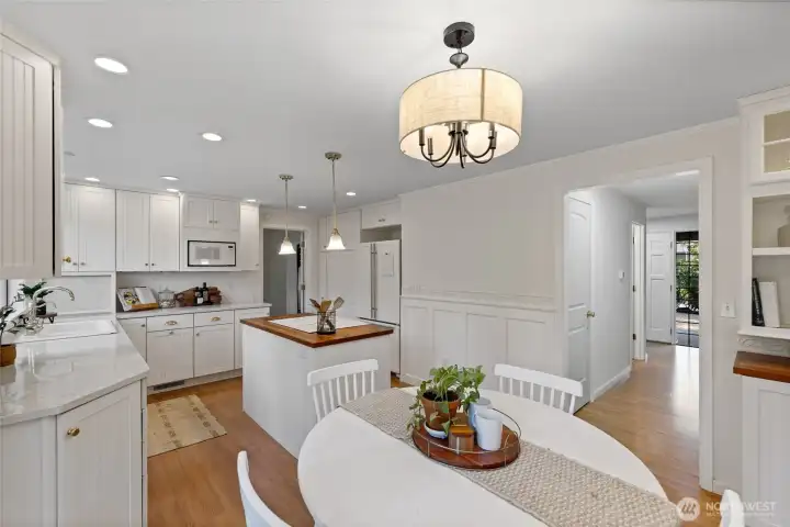 View of the kitchen looking towards the entryway.