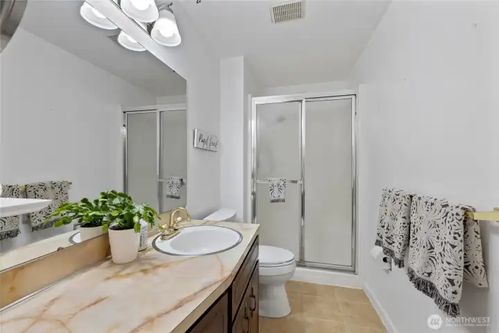 Primary bathroom features a shower.