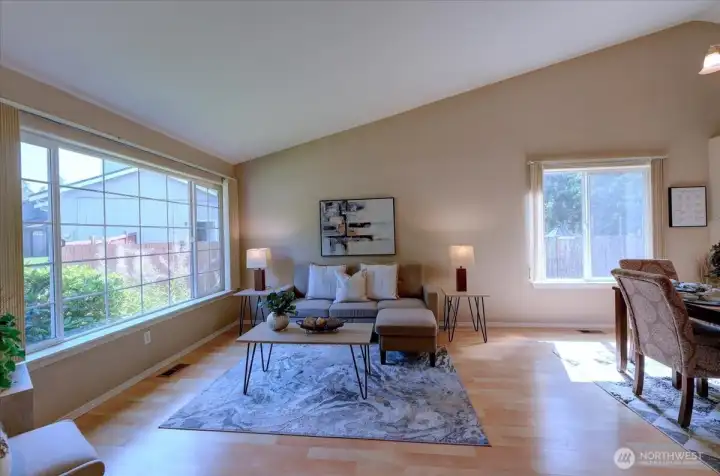 Formal living room with vaulted ceilings