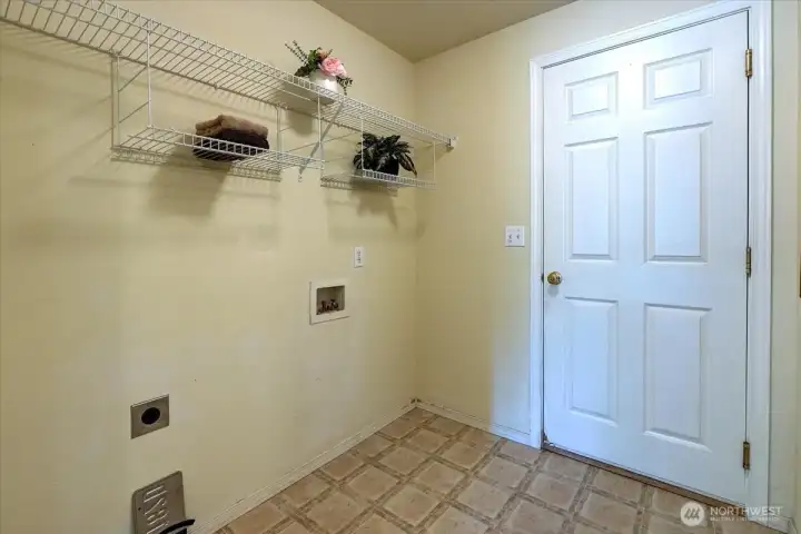 Laundry room that leads out to garage