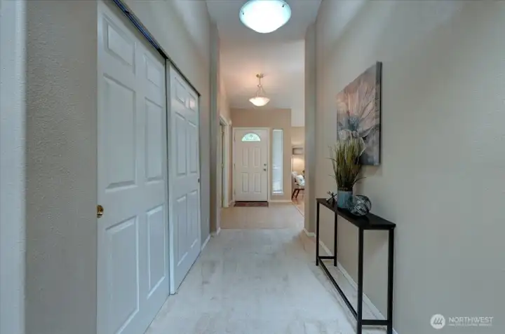 Hallway with coat closet