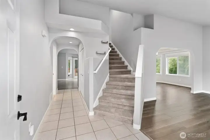 Grand entryway that leads to the formal living room and stairs to the upstairs bedrooms.