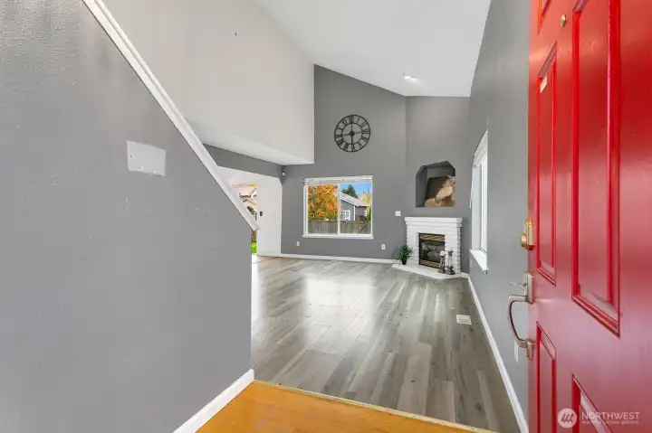 Enter into the great room/living area with vaulted ceilings and tons of natural light!