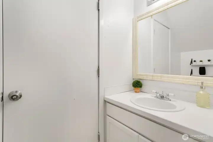 Half bath downstairs with separate access to the office/studio space.