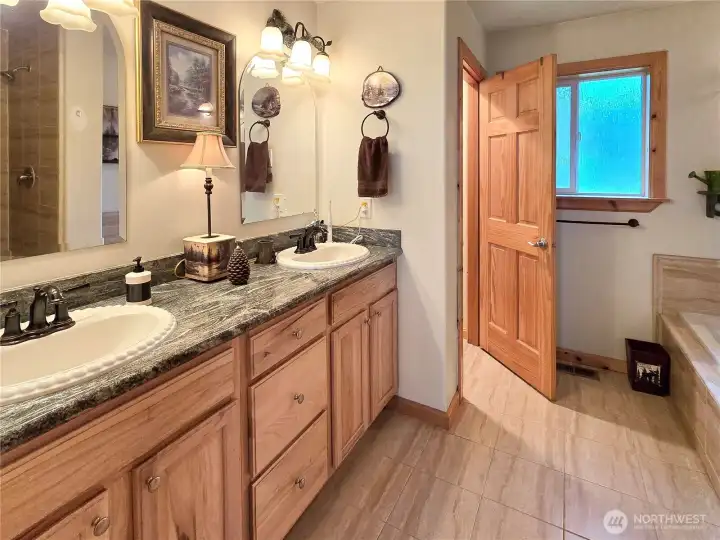 Master bath with shower and jetted tub.