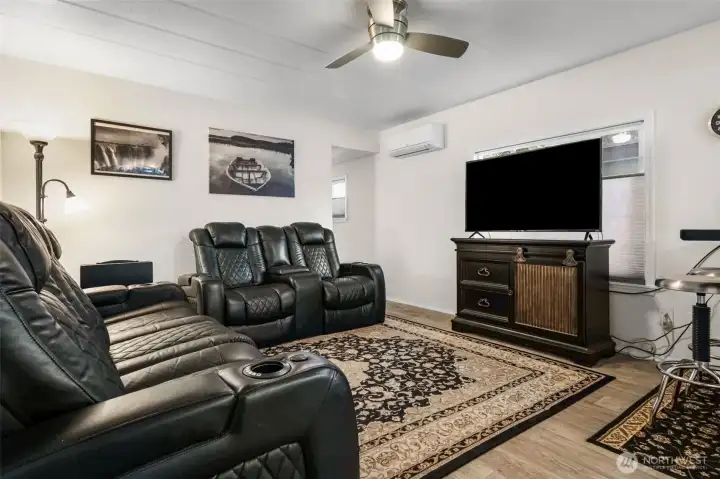 Step inside to your updated living room with newer flooring, and your mini split to keep you warm in winter and cool in summer. A modern ceiling fan can be helpful for those days in the middle.