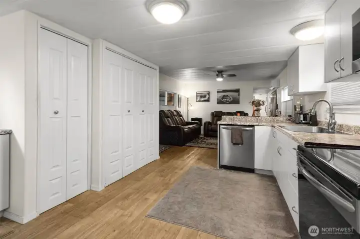 A view of the kitchen back toward the living room and hallway.