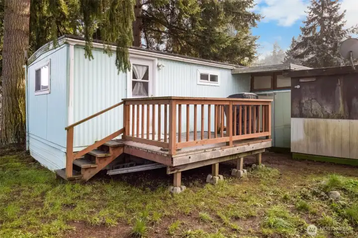 Primary bedroom door leads to a great deck and the backyard area.