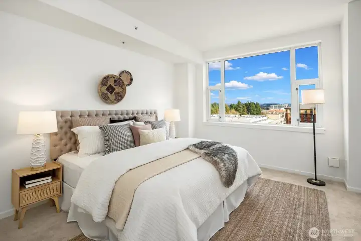 Scenery continues into your generous primary suite.