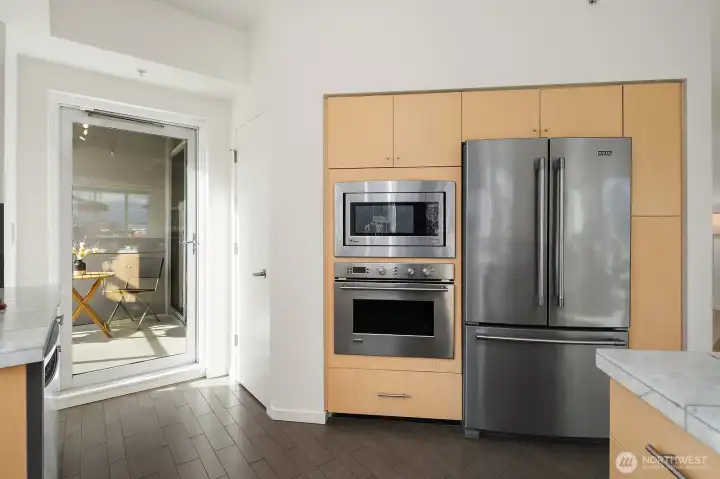 Step out to the balcony. Built-in stainless-steel appliances, too!