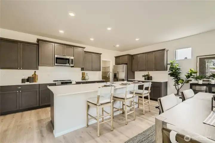 Dining to Kitchen  Photos are representation as the home is under construction.