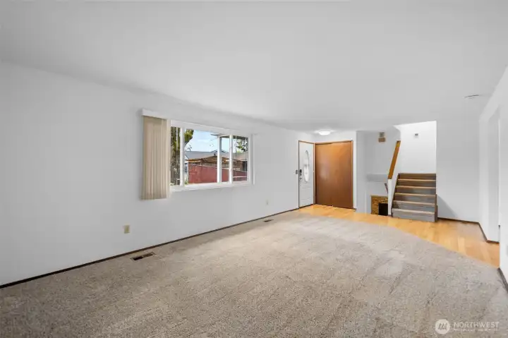 Spacious living room greets you from the front door.