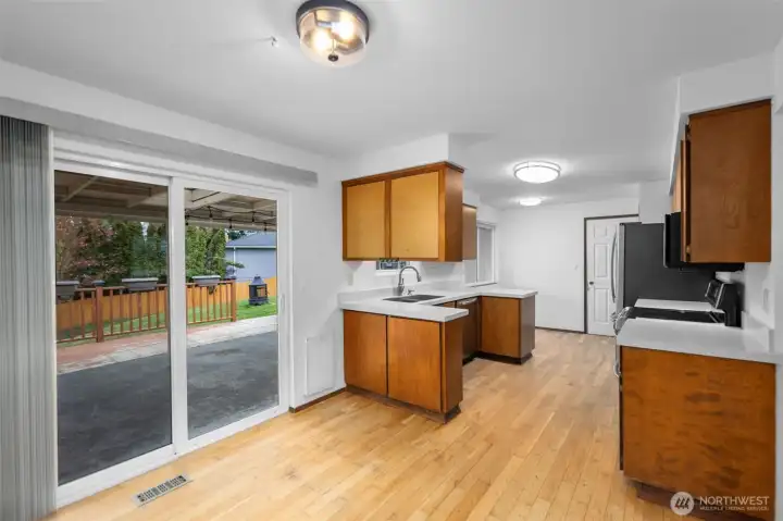 Through to the dining room which leads to the kitchen or backyard.