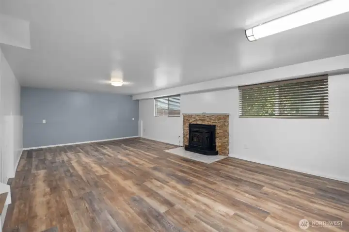 Finished basement with a pellet stove second bathroom, laundry, and ready for additional living space