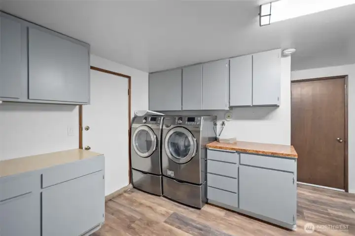 Newer washer and dryer complete the downstairs.