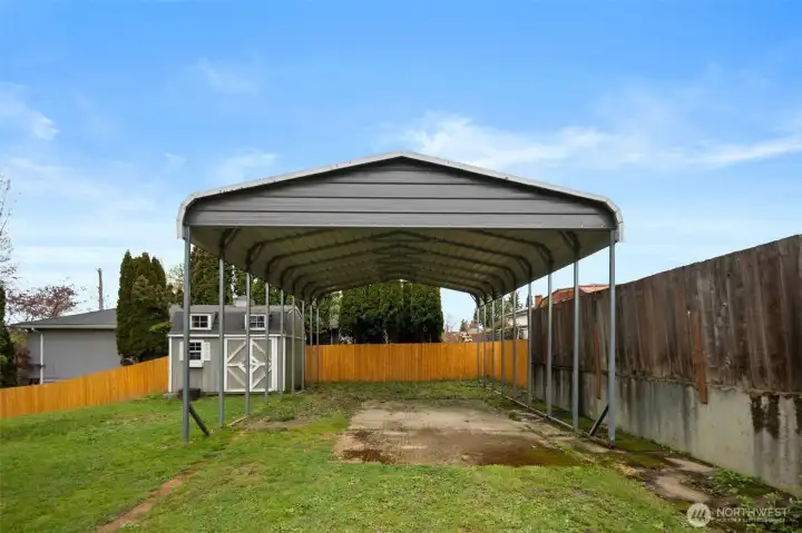 A large RV sized carport outback provides all the space you need for your toys!