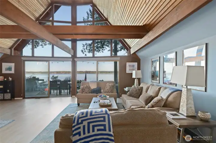 Great room with open beams, wood lined ceilings, new upper windows.  What a view.  Dining area to left.  Furniture may be available for purchase.