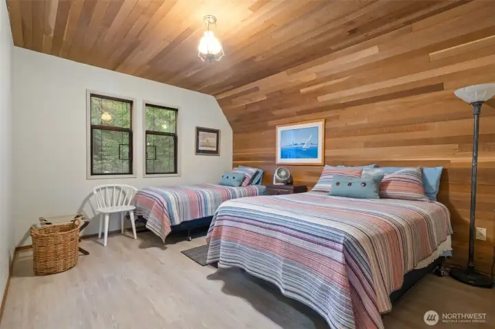 Larger main level bedroom w/cedar lined wall/ceiling