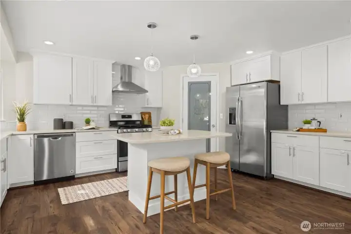 Beautifully updated kitchen with all the modern amenities, walk in pantry and gas stove