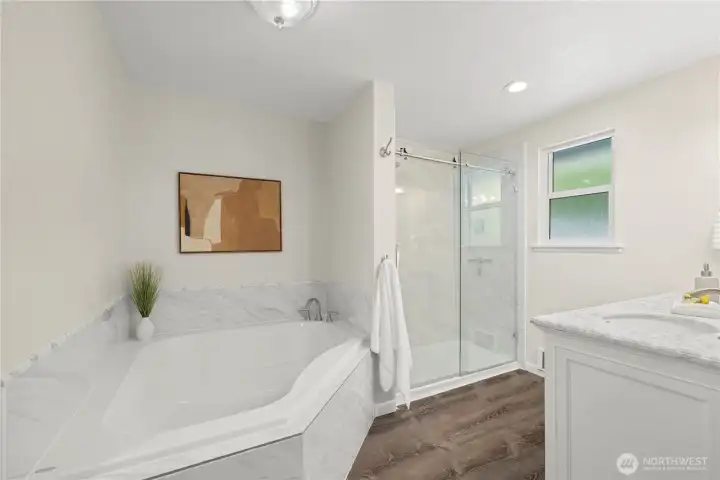 Luxurious primary bathroom with soaking tub & walk in shower