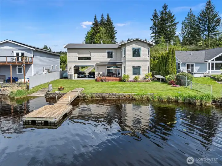 Palatial presence on serene iconic Long Lake no bank waterfront with boat launch and dock. Dont miss out on this generational owner area.