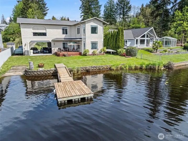 Imagine hosting birthdays, anniversaries, and swimming summer days away off this dock. Easy lawn maintenance and shower area off the side yard.