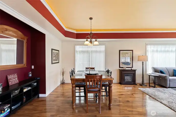 Recessed ceilings along with inset lighting caress the hardwood floors throughout the dining area and living room.