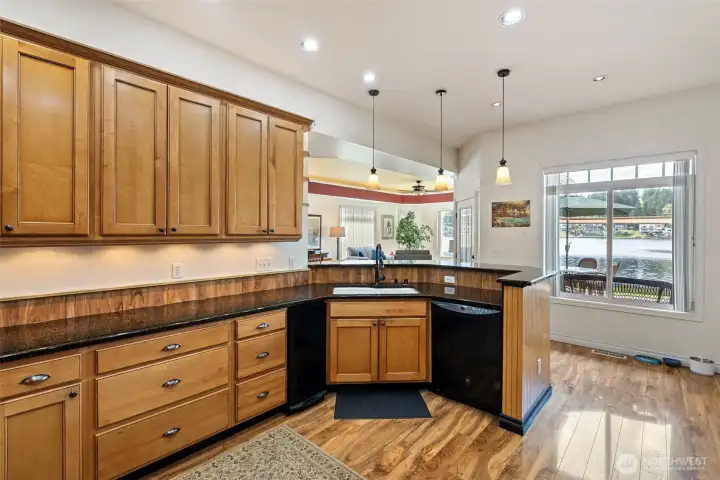Trash compactor, sink facing the waterfront, oversized countertops.