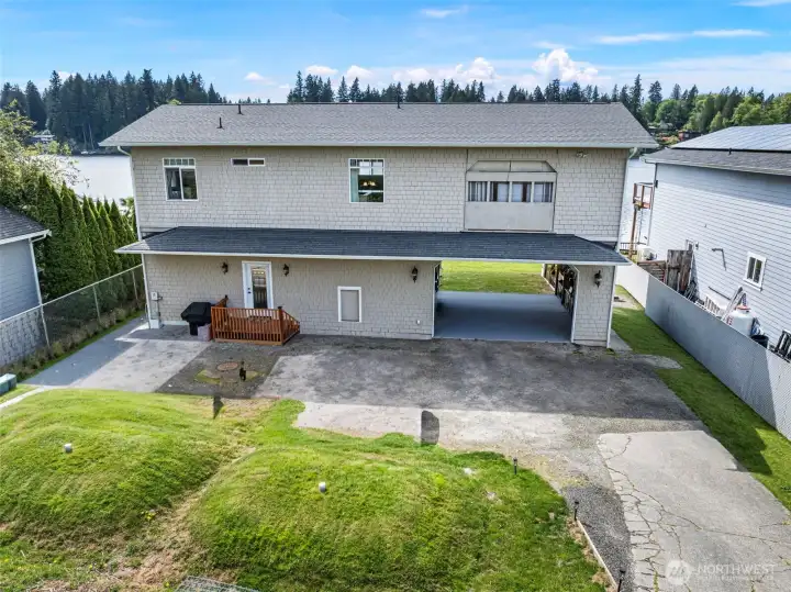 Front of home photo that also shows the section above garage that lowers down to the roof with winch to bring up large items.