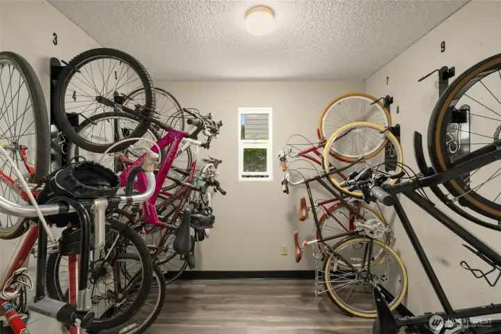 Secure bike storage room located across from unit on same floor.