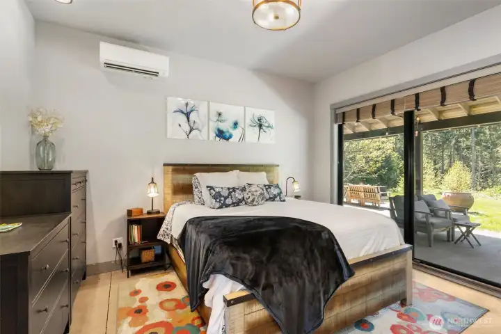 Primary bedroom with sliders to back porch
