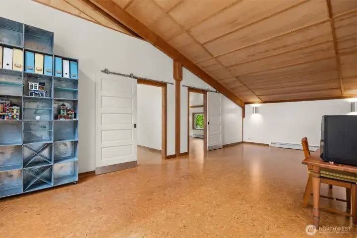 West side bedrooms have cork flooring and paneled ceilings. West side bedrooms have cork flooring and paneled ceilings.