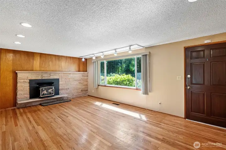 Step inside to cozy real hardwood flooring and a wood burning Fisher stove.
