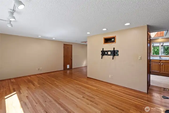 Another view of the living room peeking into the kitchen.