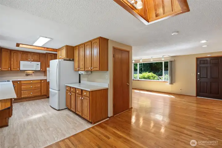 The kitchen has a lovely design and includes all appliances: refrigerator, microwave, dishwasher, stove, and wall oven.
