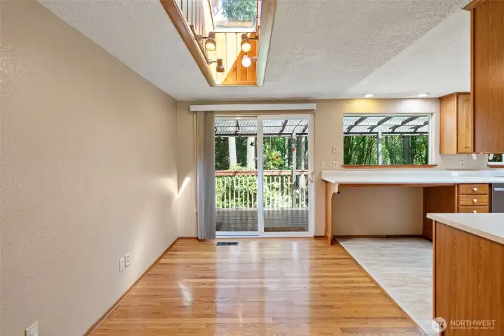 Another view of the dining room with skylight above and easy deck access.