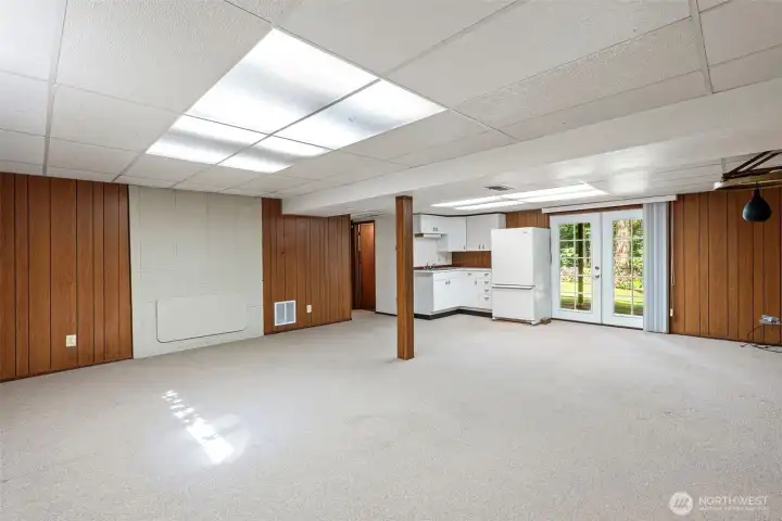 A mini kitchenette in the lower level and French doors to the outside.
