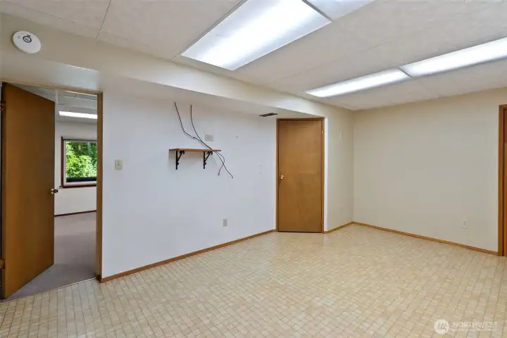 The hotwater tank is located through the closed door.
