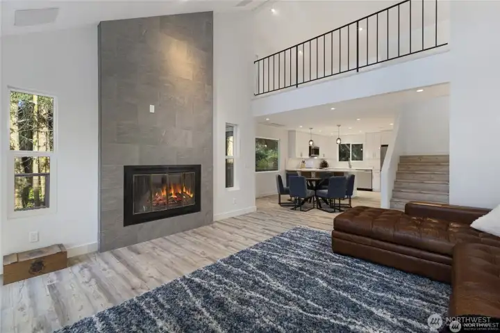 A striking slate-surround woodburning fireplace anchors the living room, adding warmth, texture, and a cozy focal point for island evenings. A striking slate-surround woodburning fireplace anchors the living room, adding warmth, texture, and a cozy focal point for island evenings.