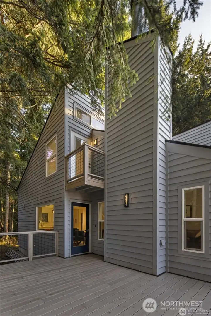 Updated decking, modern railings, and private outdoor areas enhance the home’s Northwest contemporary style and make island living easy to enjoy. Updated decking, modern railings, and private outdoor areas enhance the home’s Northwest contemporary style and make island living easy to enjoy.